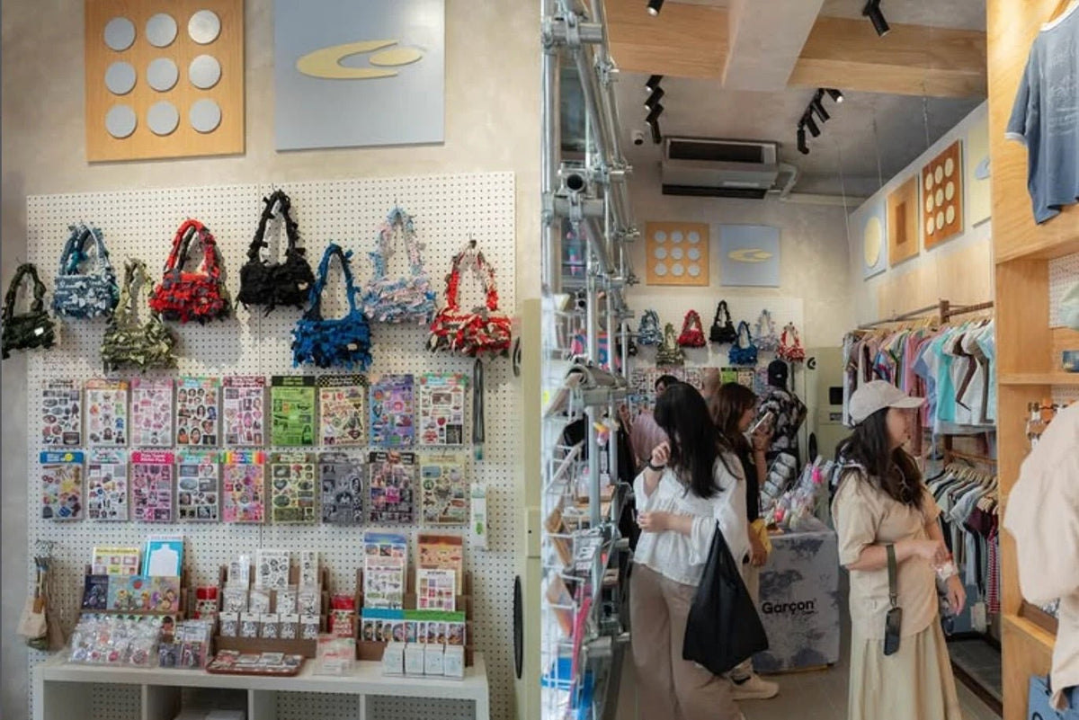 Ari interior: pegboard of handmade bags and stickers beside a scaffold-pipe frame