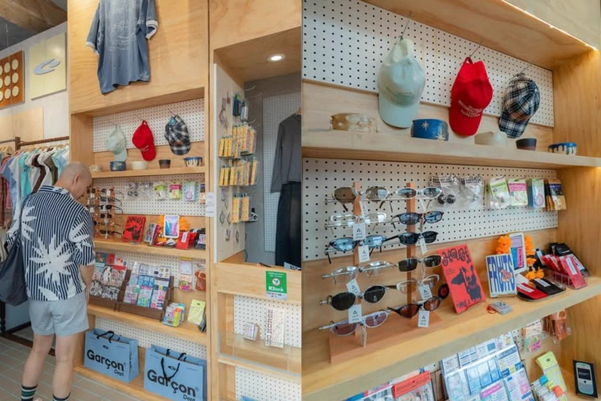 Shelves of caps, sunglasses, zines and stationery in the Ari store