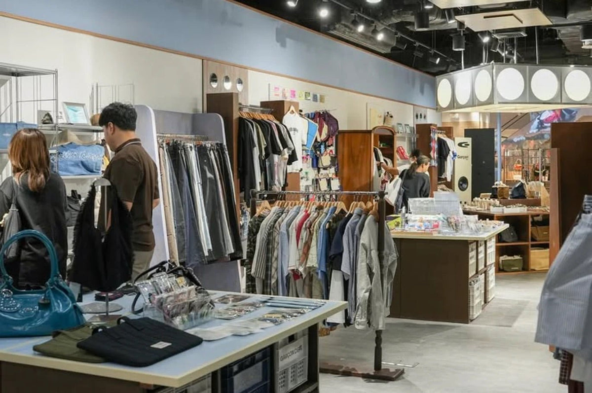 CentralWorld shop floor with display tables, racks and wooden fixtures